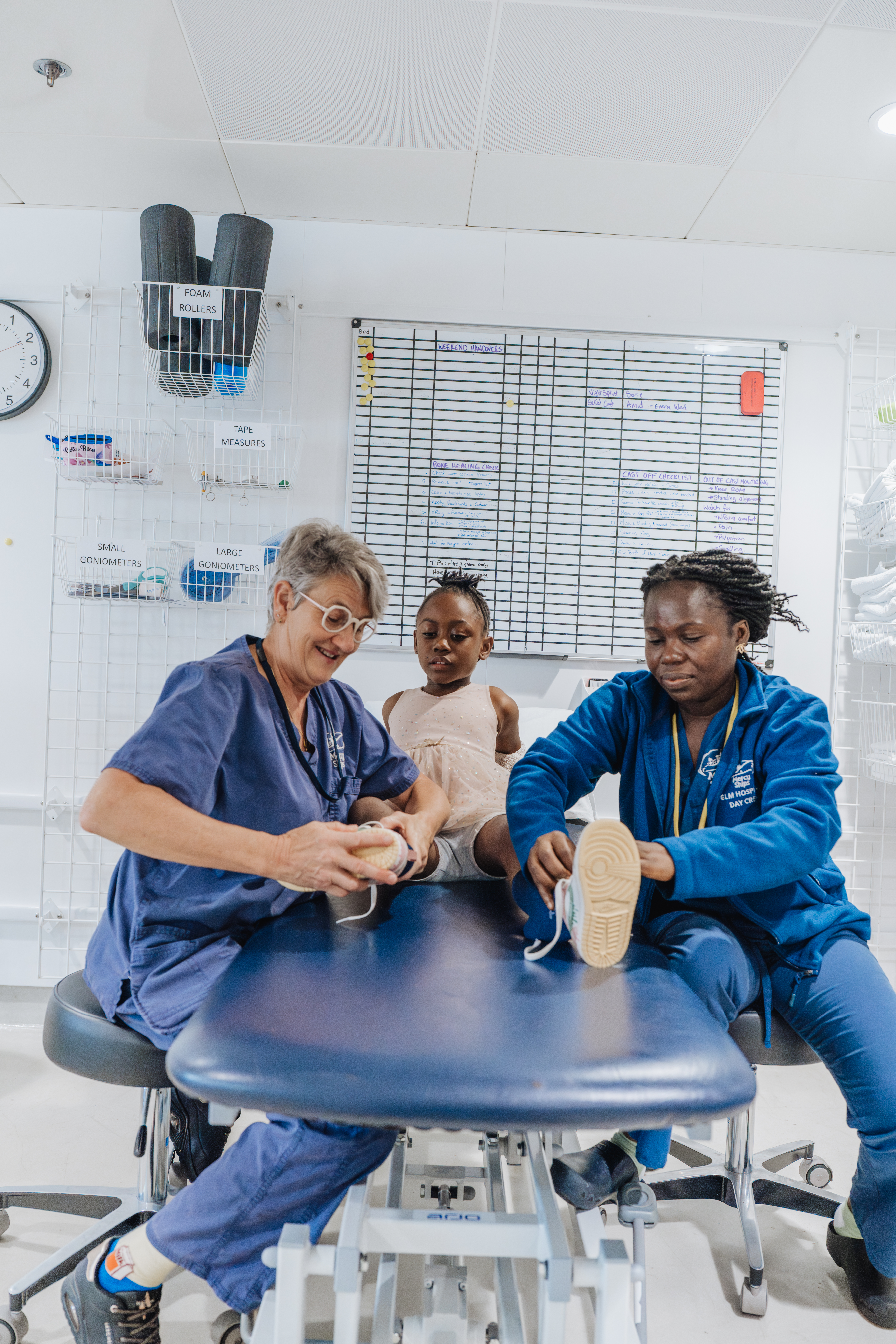 orthopedic patients receiving shoes after their cast change.